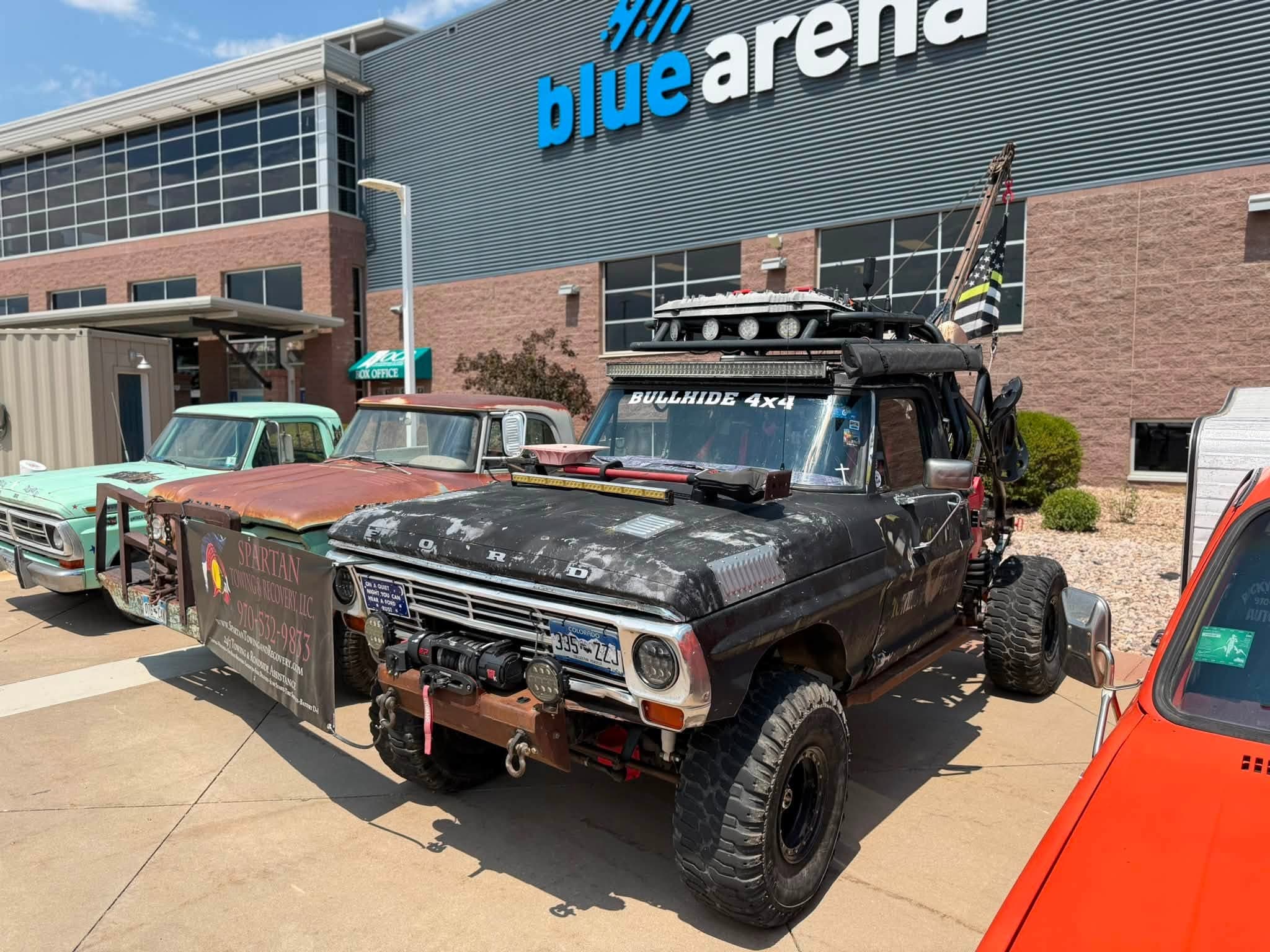 Custom lifted pickup truck loaded with recovery equipment