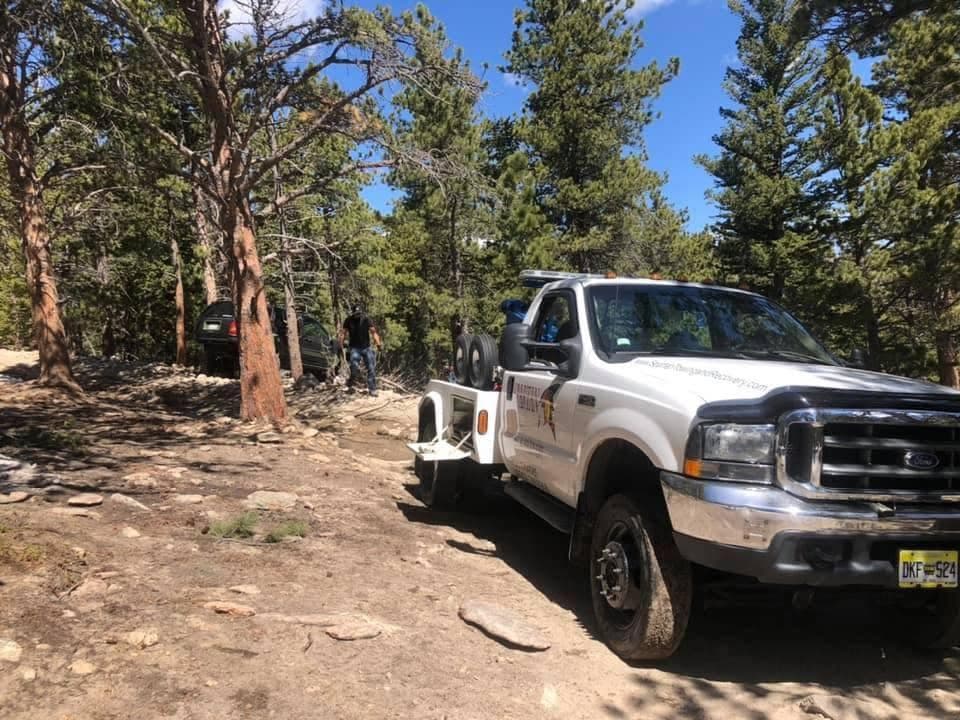 Spartan service truck on a forest road in the Colorado high country